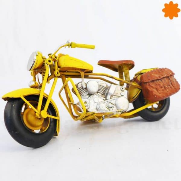 Figurita que es una reproducción metal motocicleta metálica de estilo retro